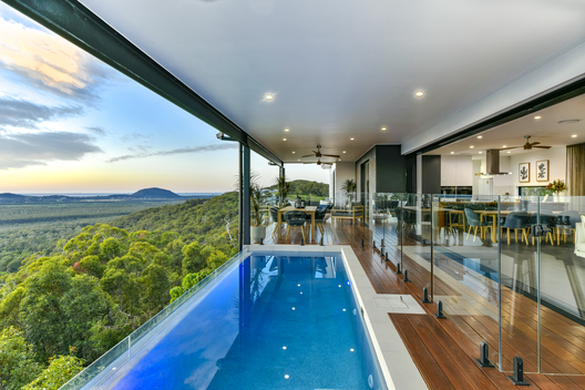 Pool looking over scenery next to  deck 