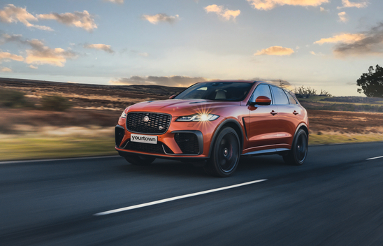 Orange Jaguar F-Pace front view, left hand drive model is shown.