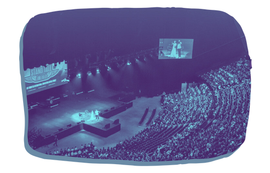 Large indoor stage surrounding a raised stage