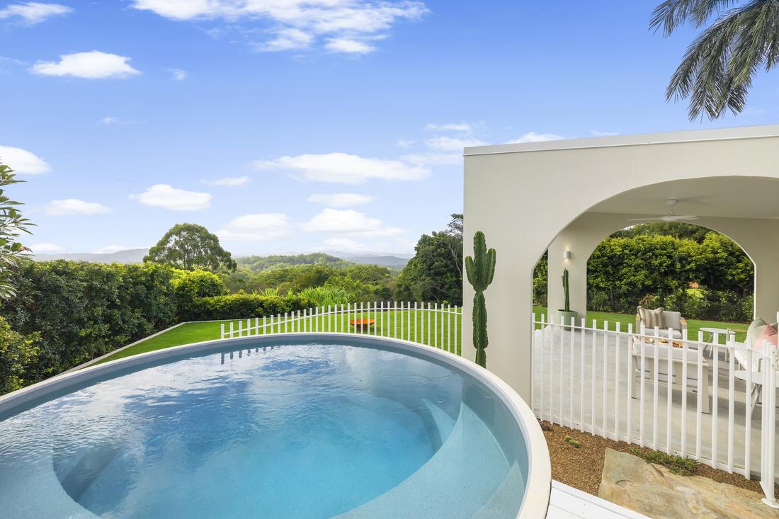 Round plungie pool with mountain views over Buderim, Sunshine Coast, with alfresco deck to the right.